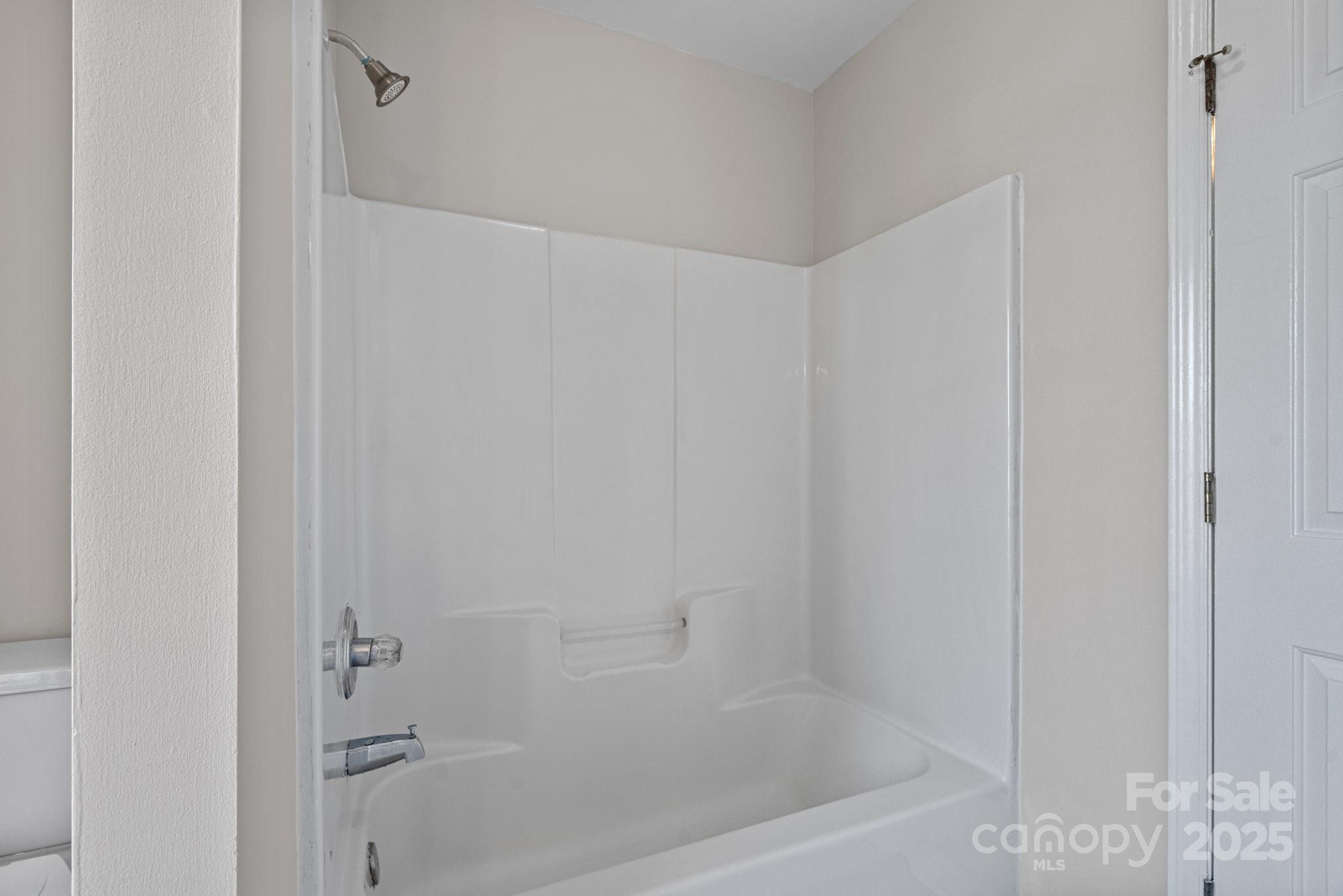 7100 Windsong Way Wingate, NC 28174 - Photo 21 of 26 a close up of a bathtub