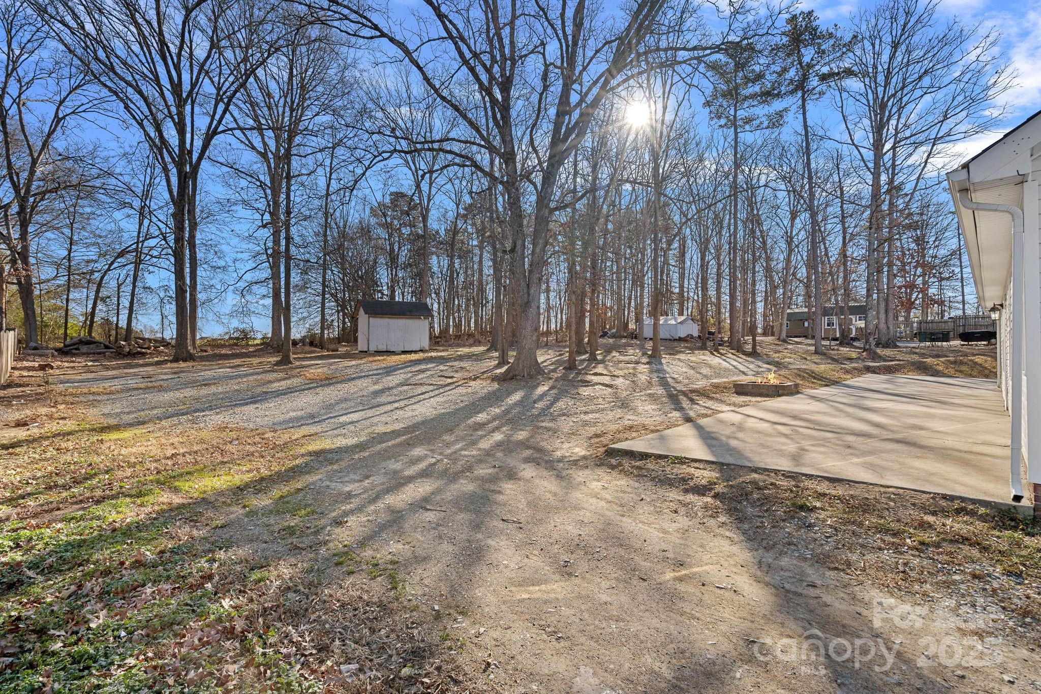 7100 Windsong Way Wingate, NC 28174 - Photo 23 of 26 a backyard of a house with trees