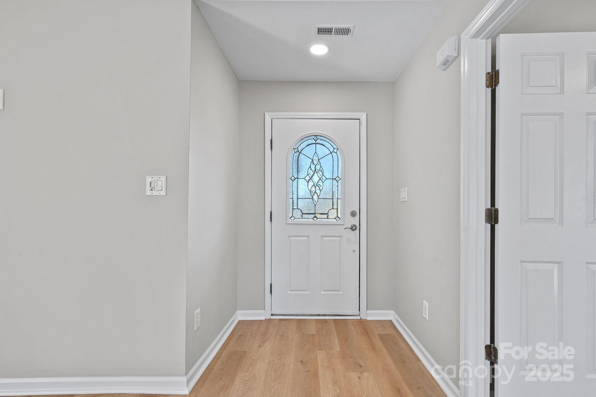 7100 Windsong Way Wingate, NC 28174 - Photo 3 of 26 a view of room with window and hallway