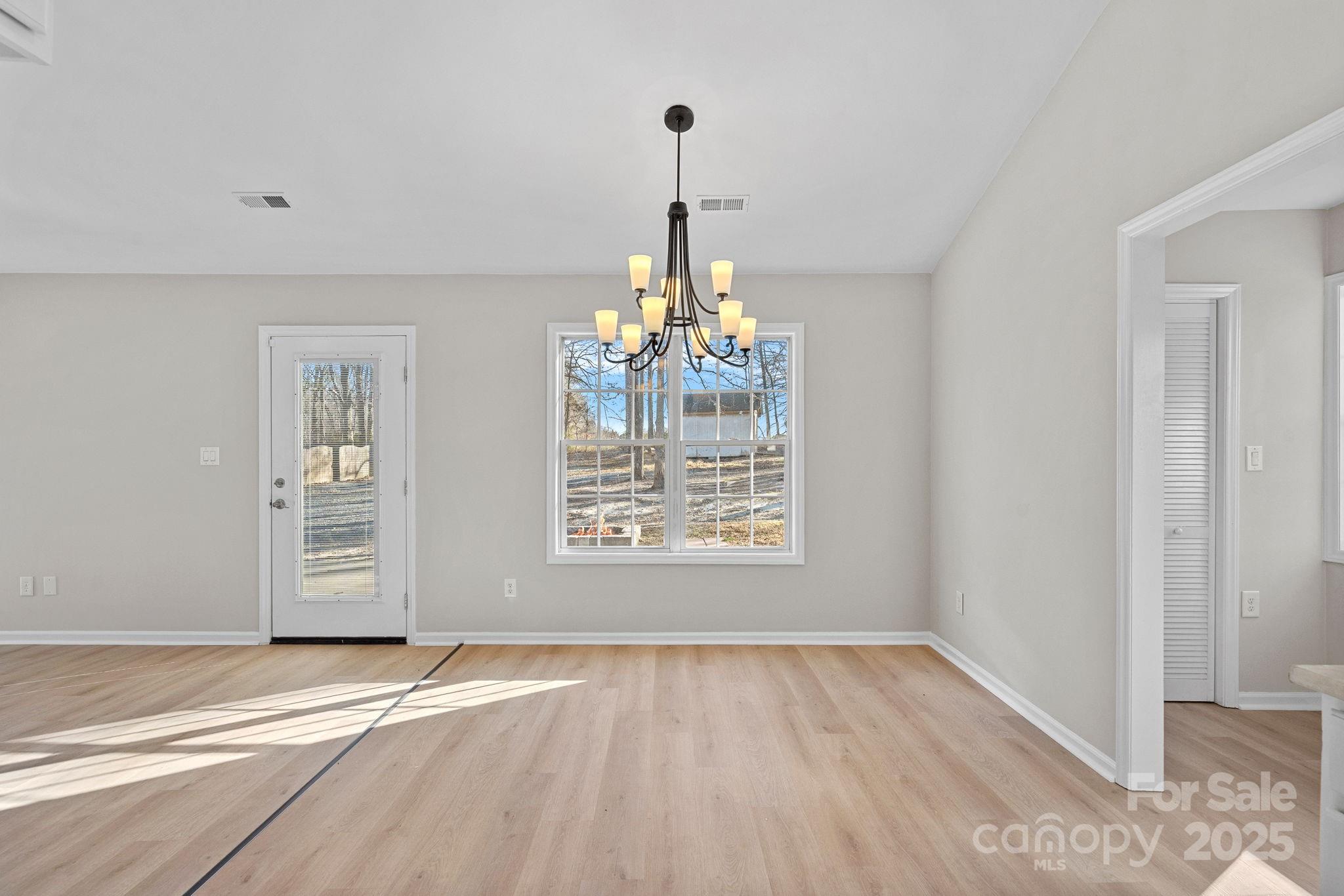 7100 Windsong Way Wingate, NC 28174 - Photo 8 of 26 a view of an empty room with a window