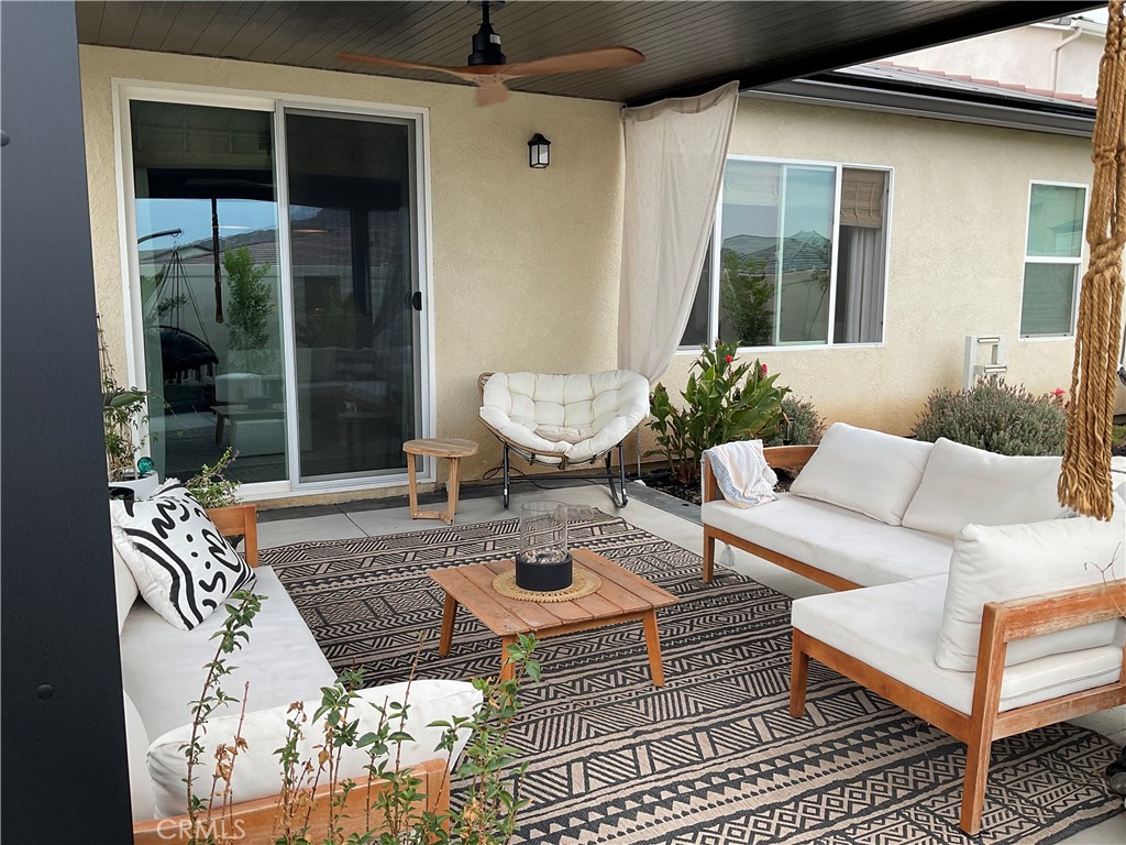 30153 Cyn Rnch Drive Homeland, CA 92548 - Photo 14 of 19 a view of a patio with couches table and chairs and potted plants