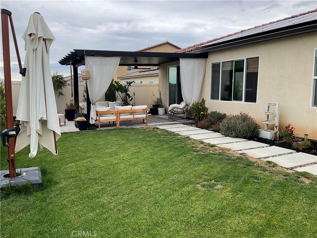 30153 Cyn Rnch Drive Homeland, CA 92548 - Photo 16 of 19 a view of a house with backyard and porch