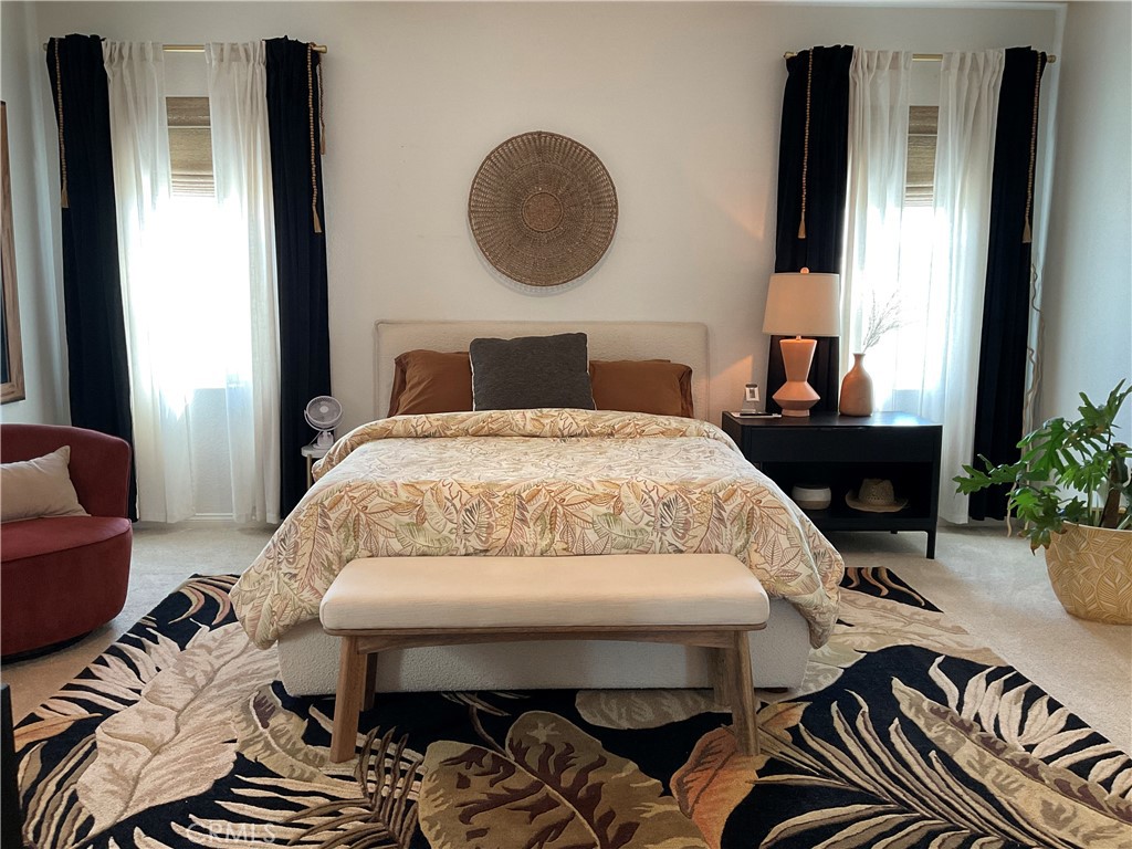 30153 Cyn Rnch Drive Homeland, CA 92548 - Photo 5 of 19 a bedroom with a bed and a potted plant