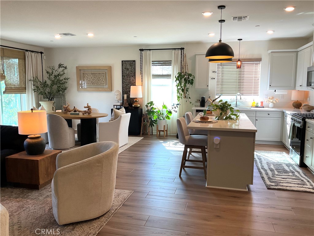 30153 Cyn Rnch Drive Homeland, CA 92548 - Photo 8 of 19 a dining room with wooden floor and furniture