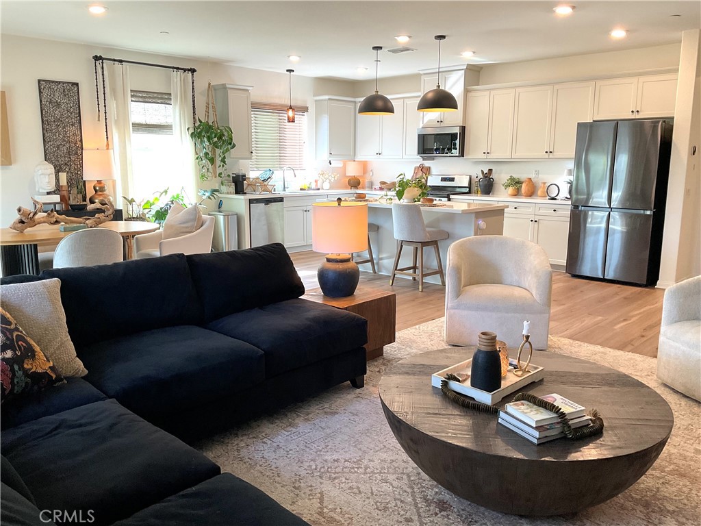 30153 Cyn Rnch Drive Homeland, CA 92548 - Photo 10 of 19 a living room with stainless steel appliances furniture and a kitchen view
