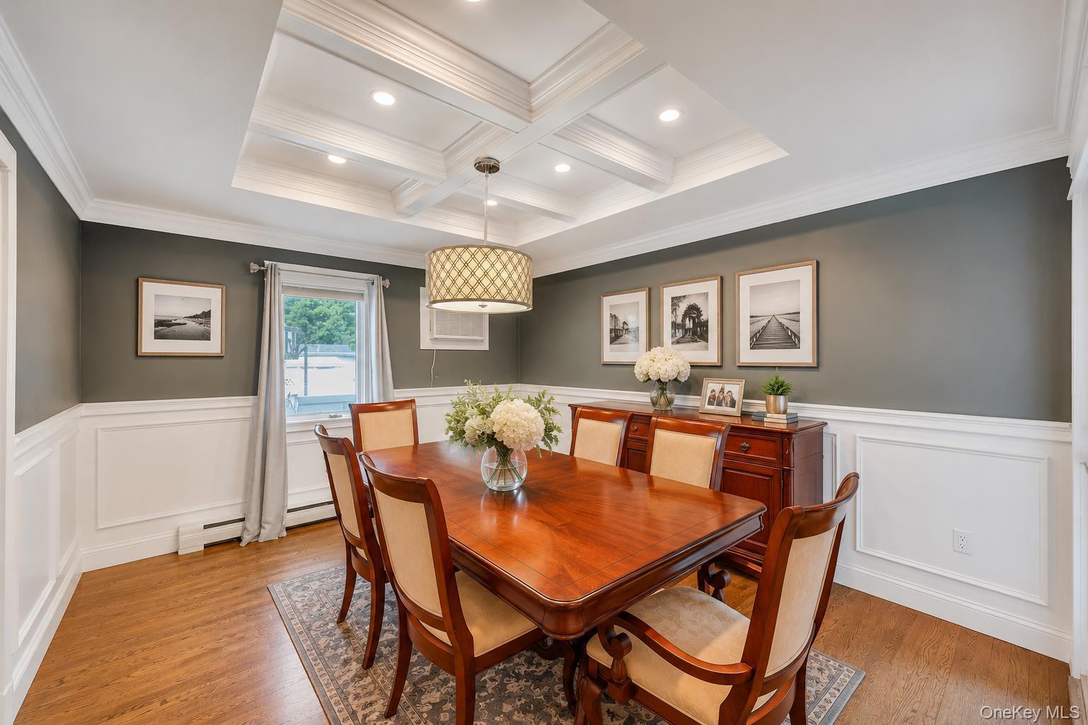 19 Joan Road Bay Shore, NY 11706 - Photo 14 of 50 Coffered ceiling with recessed lighting and a decorative chandelier