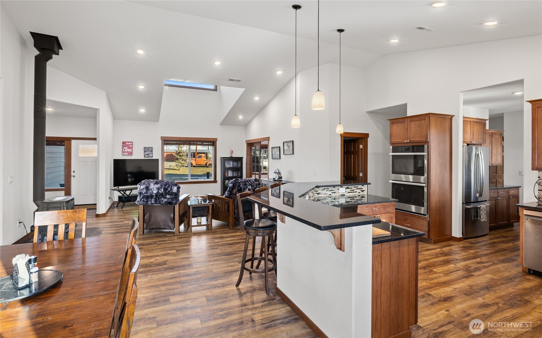 583 Rein Road Ellensburg, WA 98926 - Photo 13 of 40 a kitchen with stainless steel appliances kitchen island granite countertop a stove refrigerator and cabinets