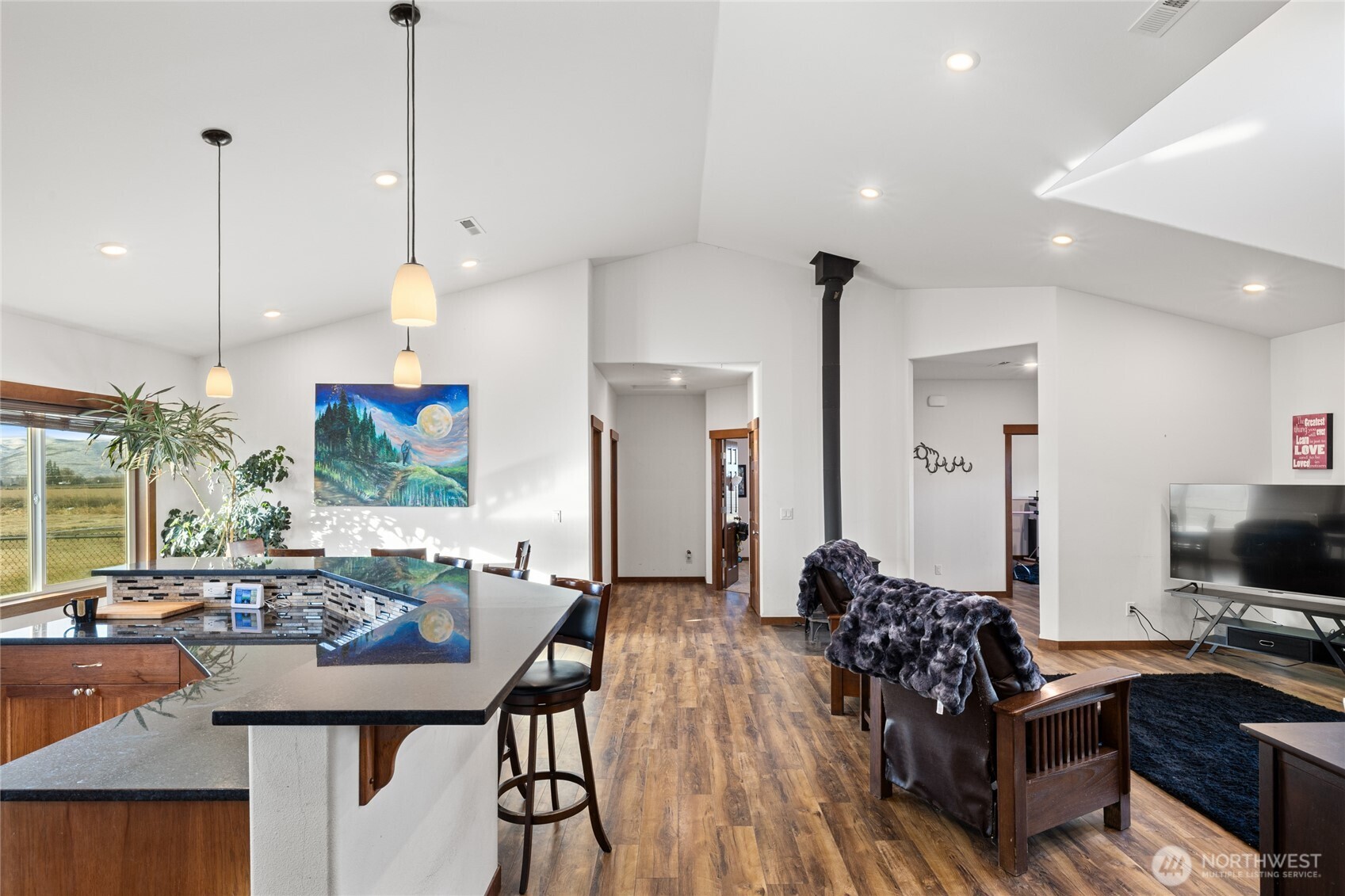 583 Rein Road Ellensburg, WA 98926 - Photo 15 of 40 a living room with furniture a flat screen tv and a large window