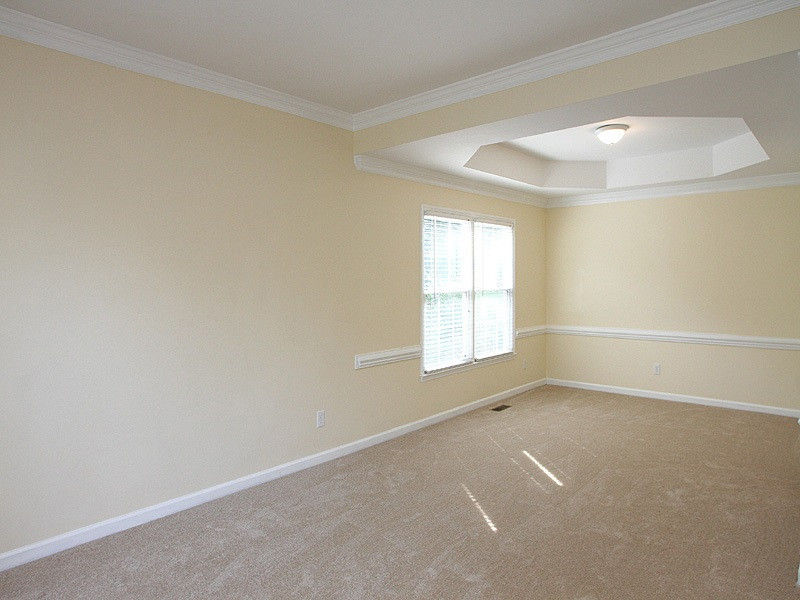 2305 Kendricks Court Raleigh, NC 27613 - Photo 4 of 23 Spacious dining room with trey ceiling, crown molding, and chair rail. Dining Room