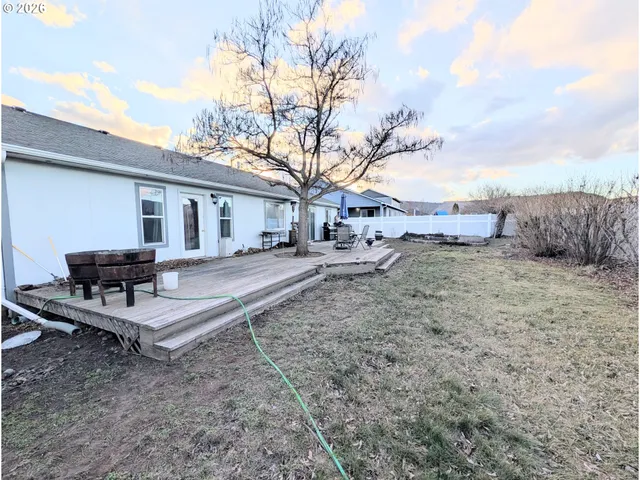 a view of a backyard with a sitting area