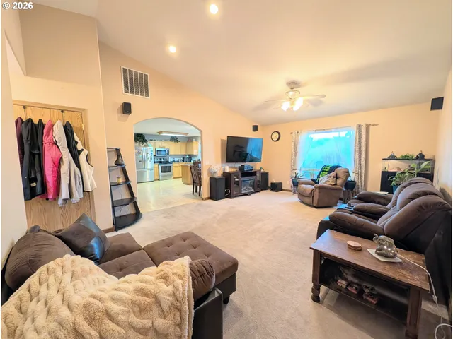 a living room with furniture gym equipment and a view of living room