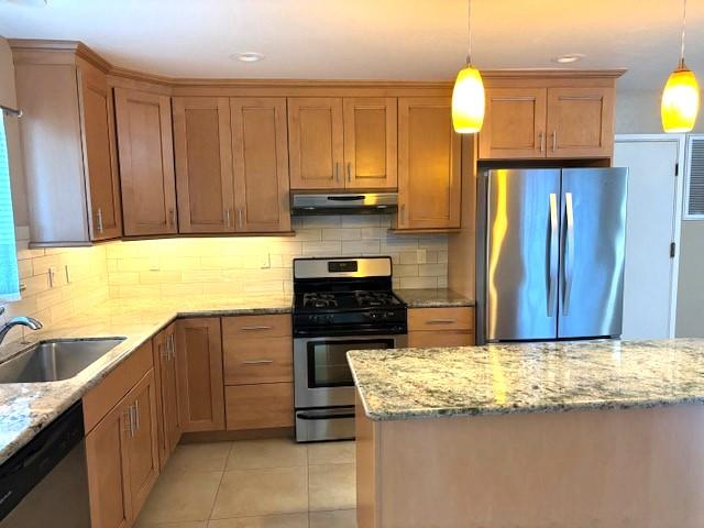 317 Doris Avenue Aptos, CA 95003 - Photo 3 of 15 a kitchen with granite countertop a sink a stove and cabinets