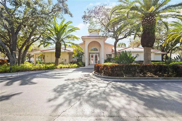 a view of a house with a yard and chandelier