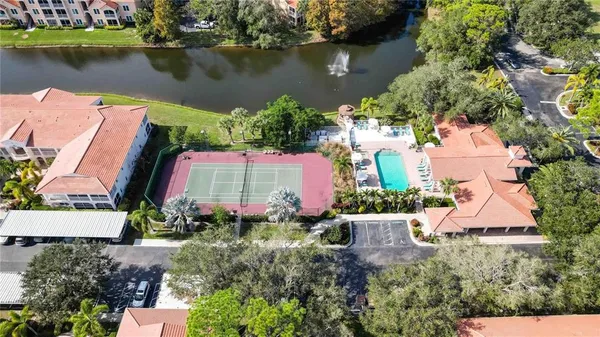 an aerial view of a house with a lake view