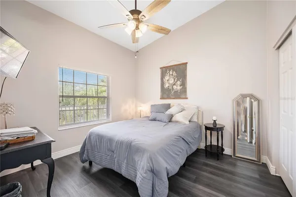 a bedroom with bed and a window