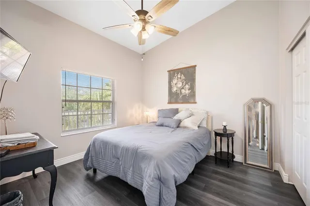 a bedroom with bed and a window