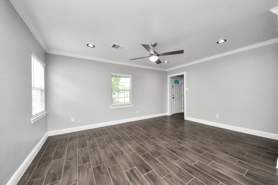 135 Rustic Drive Pasadena, TX 77502 - Photo 11 of 31 wooden floor in an empty room with a window