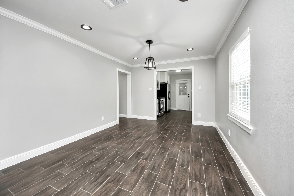 135 Rustic Drive Pasadena, TX 77502 - Photo 13 of 31 a view of an empty room with wooden floor and a window