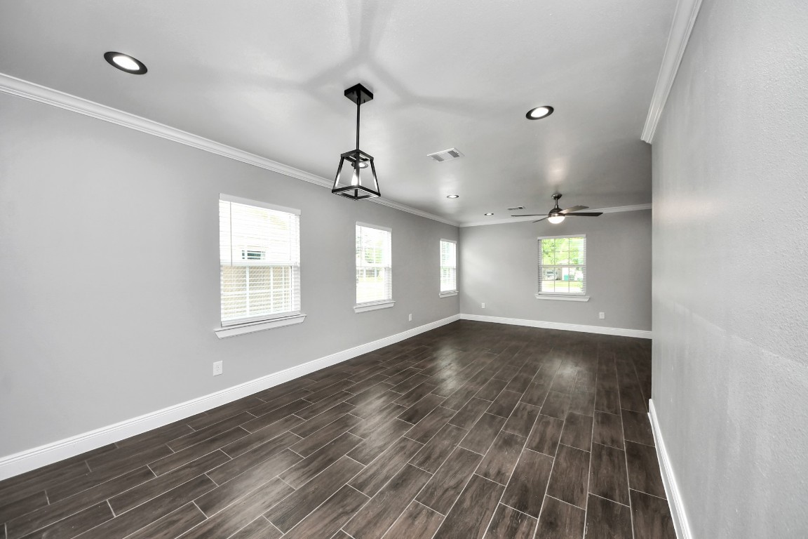 135 Rustic Drive Pasadena, TX 77502 - Photo 15 of 31 a view of an empty room with wooden floor and a window