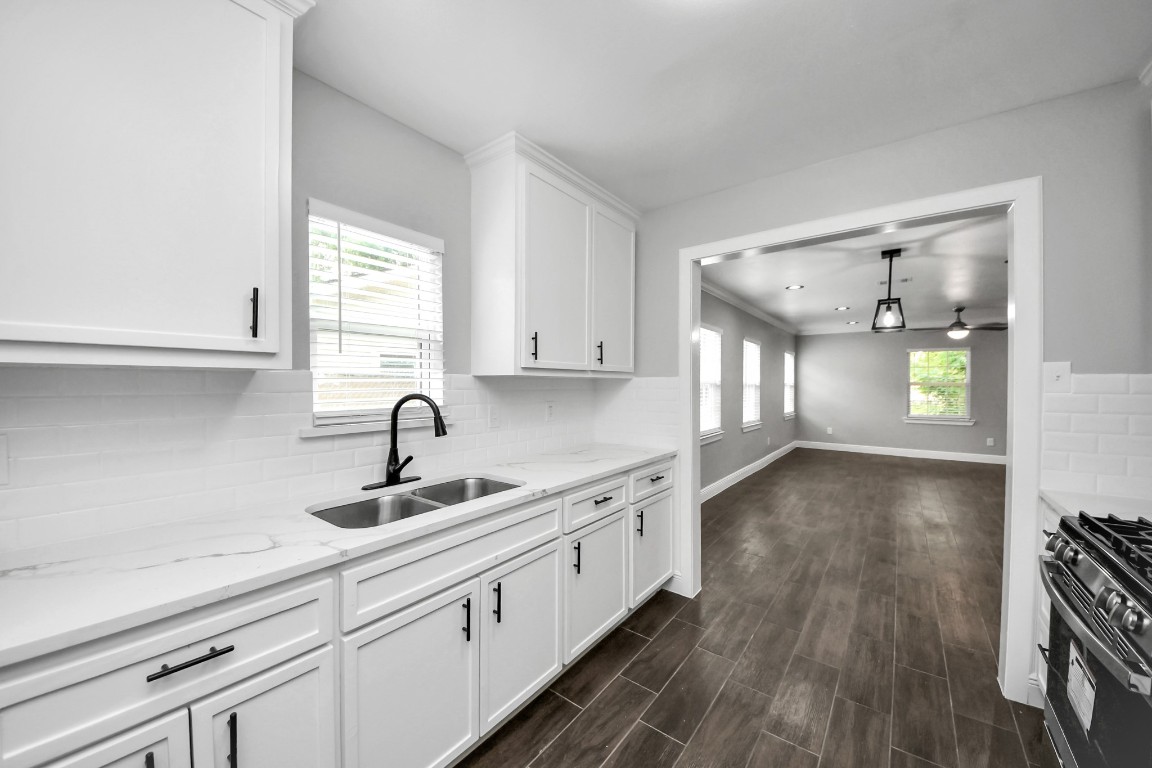 135 Rustic Drive Pasadena, TX 77502 - Photo 17 of 31 a kitchen with sink cabinets and window
