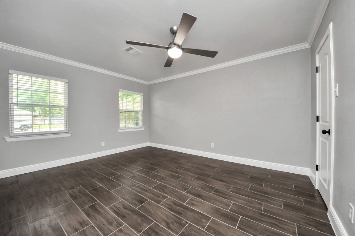 135 Rustic Drive Pasadena, TX 77502 - Photo 18 of 31 a view of an empty room with wooden floor and a window