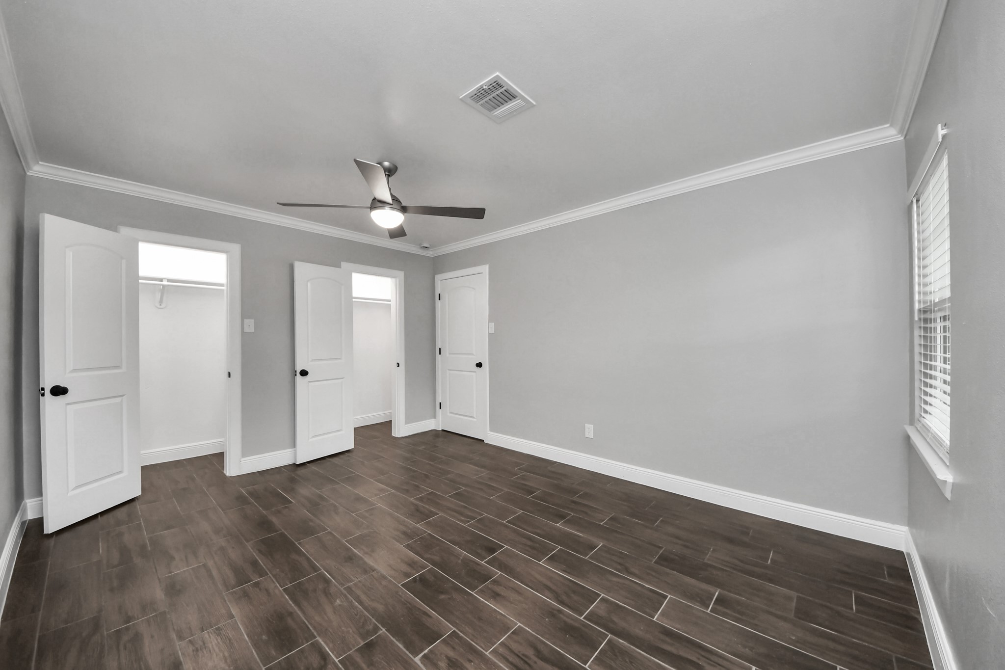 135 Rustic Drive Pasadena, TX 77502 - Photo 20 of 31 a view of an empty room with wooden floor and a window