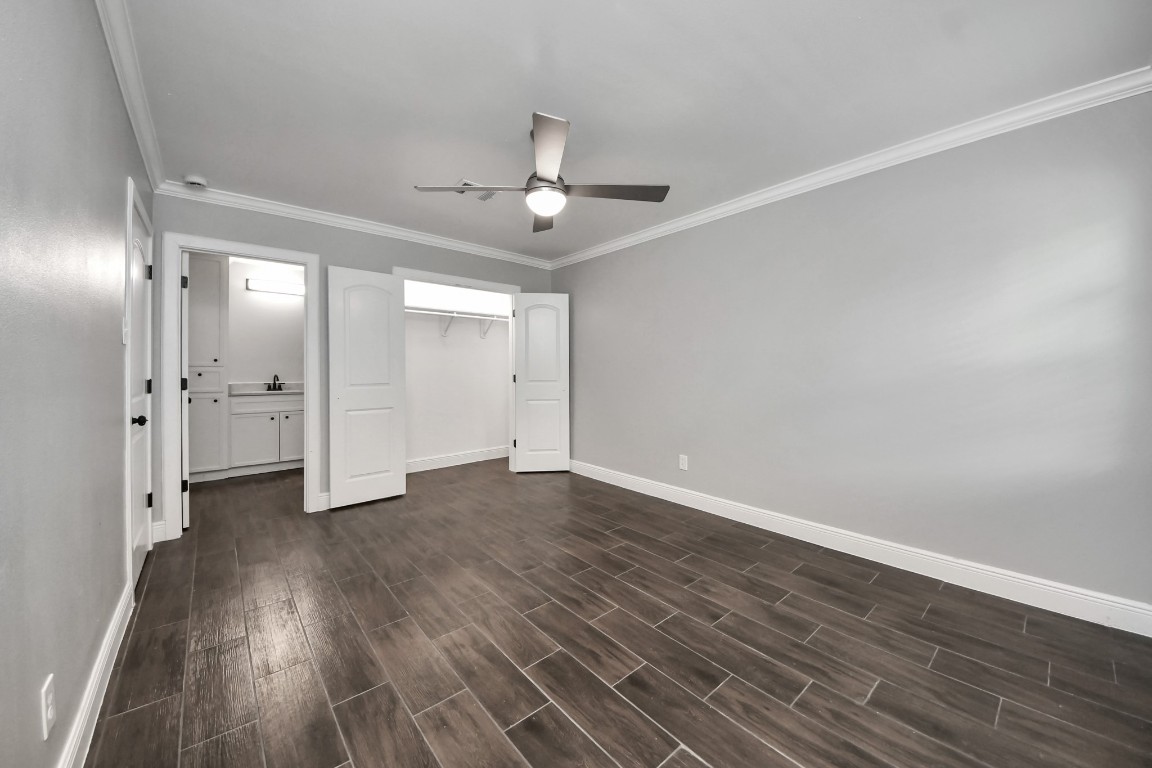 135 Rustic Drive Pasadena, TX 77502 - Photo 24 of 31 wooden floor in an empty room with a window