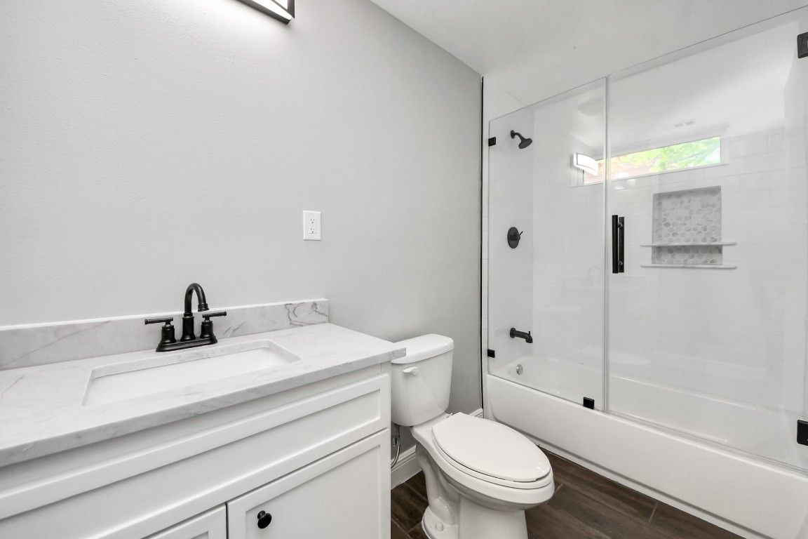 135 Rustic Drive Pasadena, TX 77502 - Photo 25 of 31 a bathroom with a sink a toilet and shower