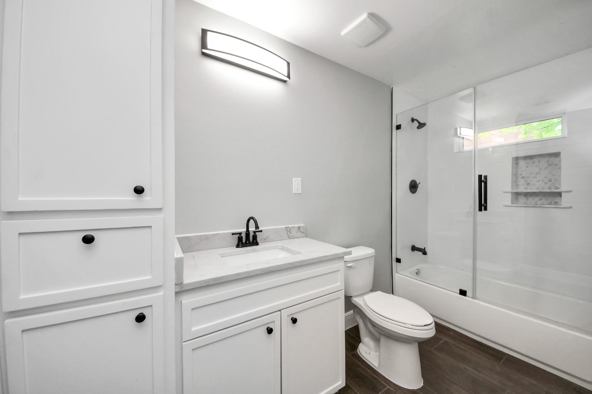 135 Rustic Drive Pasadena, TX 77502 - Photo 26 of 31 a bathroom with a sink a toilet and shower