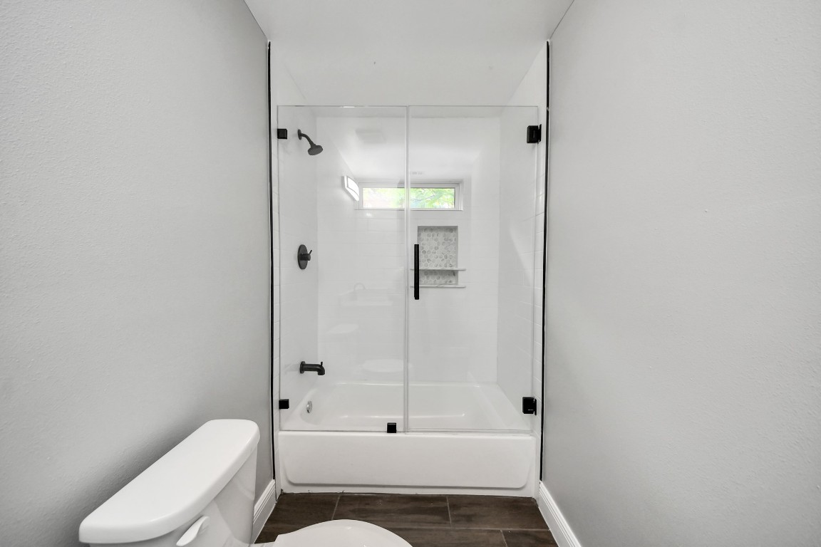 135 Rustic Drive Pasadena, TX 77502 - Photo 27 of 31 a bathroom with a toilet and shower