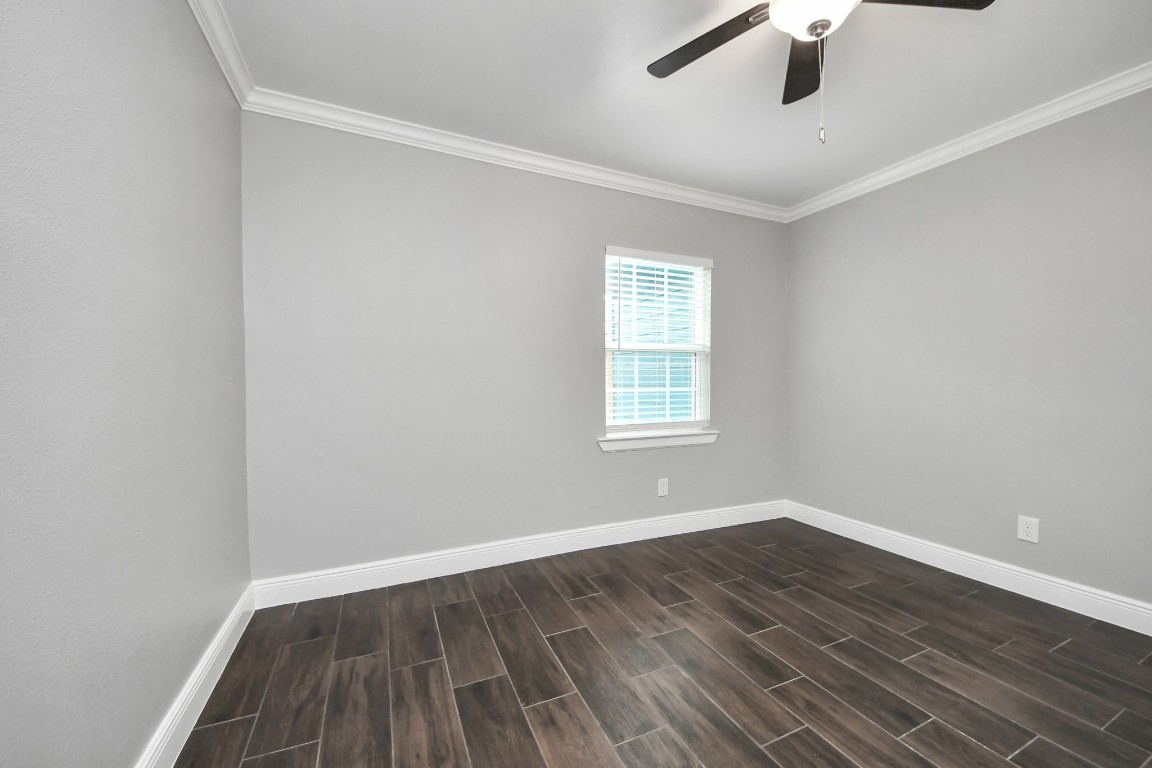 135 Rustic Drive Pasadena, TX 77502 - Photo 28 of 31 wooden floor in an empty room with a window