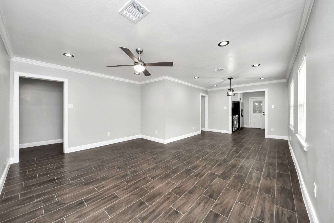 135 Rustic Drive Pasadena, TX 77502 - Photo 10 of 31 wooden floor in an empty room with a window