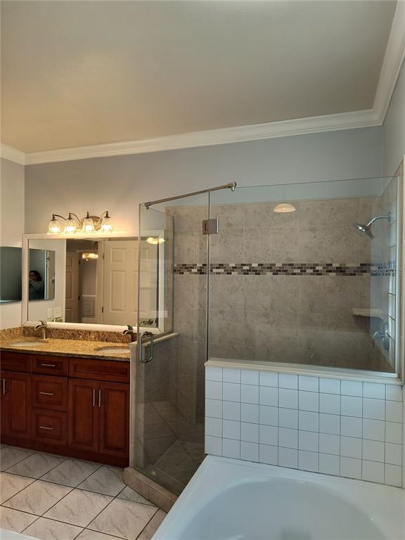 3201 Settlers Trail St. Cloud, FL 34772 - Photo 16 of 38 a bathroom with a granite countertop sink a toilet and shower