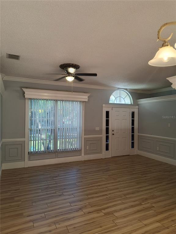 3201 Settlers Trail St. Cloud, FL 34772 - Photo 17 of 38 a view of an empty room with wooden floor and a window