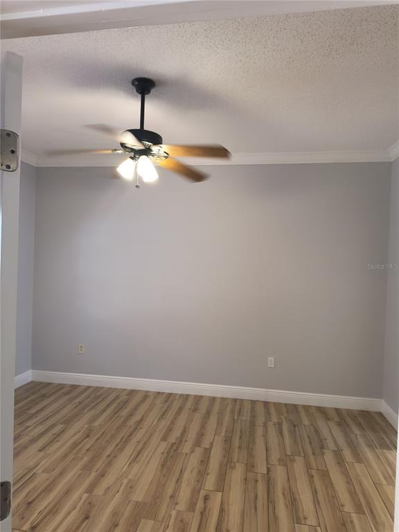 3201 Settlers Trail St. Cloud, FL 34772 - Photo 21 of 38 a view of an empty room and chandelier fan
