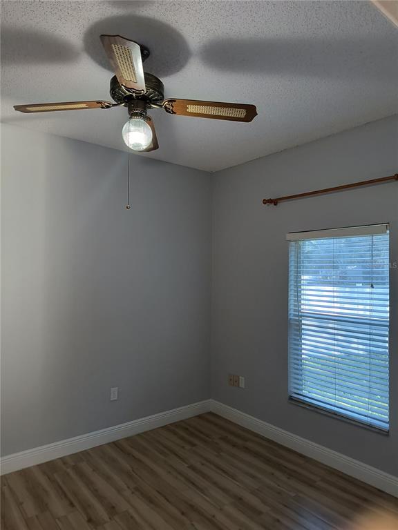 3201 Settlers Trail St. Cloud, FL 34772 - Photo 30 of 38 a view of a room with a window and wooden floor