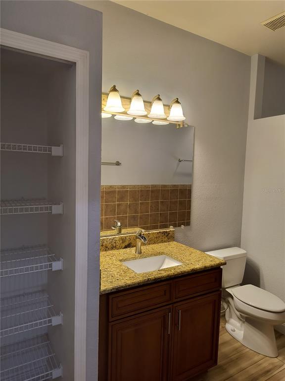 3201 Settlers Trail St. Cloud, FL 34772 - Photo 31 of 38 a bathroom with a sink and a toilet