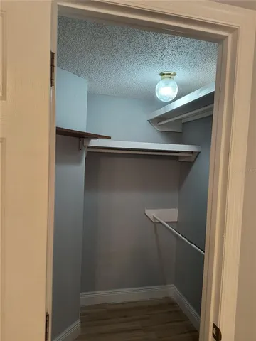 a view of an empty walk in closet