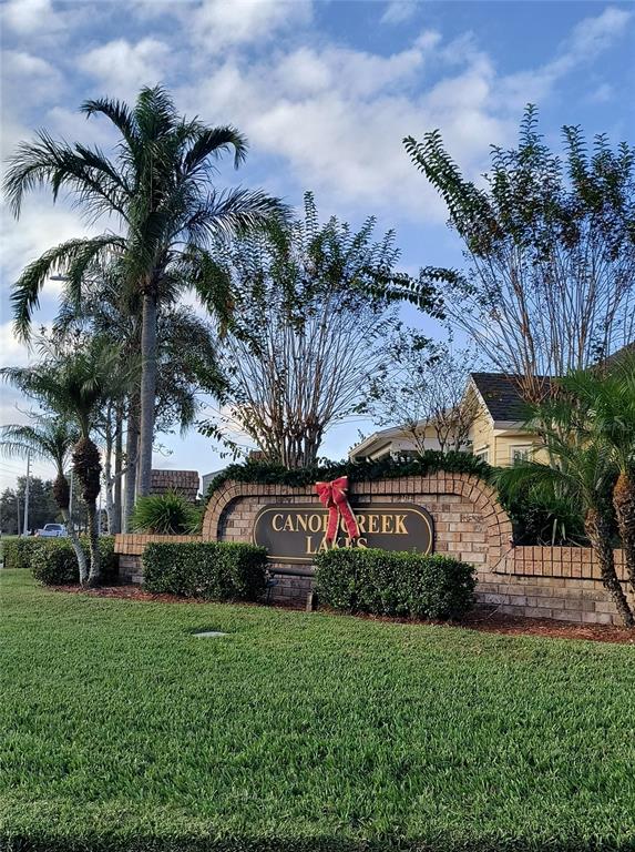 3201 Settlers Trail St. Cloud, FL 34772 - Photo 38 of 38 a front view of a house with a garden and trees