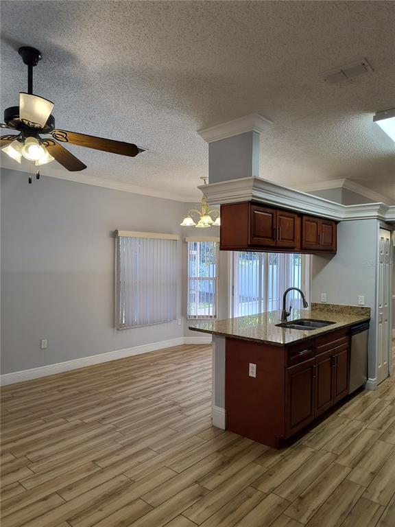 3201 Settlers Trail St. Cloud, FL 34772 - Photo 6 of 38 a kitchen with stainless steel appliances granite countertop a sink and a stove