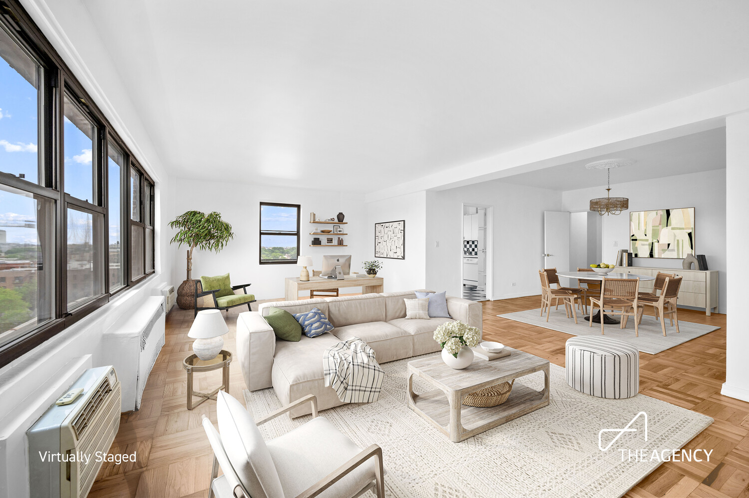 a living room with furniture large window and a table