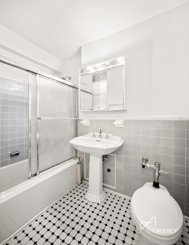 303 Beverley Road, Unit 11A Brooklyn, NY 11218 - Photo 7 of 11 a bathroom with a sink toilet and shower