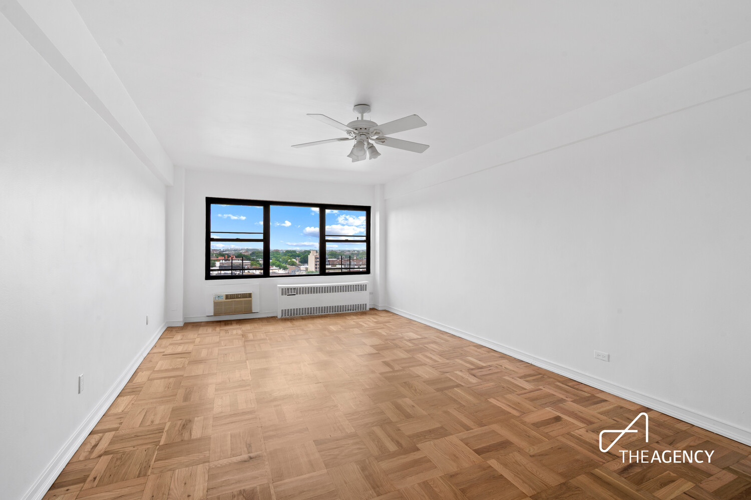 303 Beverley Road, Unit 11A Brooklyn, NY 11218 - Photo 8 of 11 wooden floor in an empty room with a window