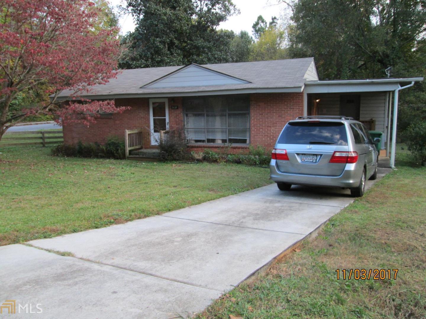 3137 Brook Drive, Unit 1 Decatur, GA 30033 - Photo 1 of 1 a car parked in front of a house