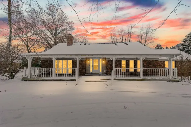 a view of a house with a roof deck