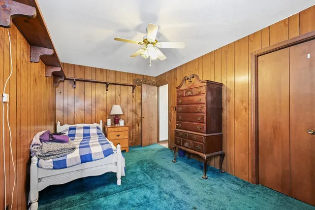 a bathroom with a sink a toilet and shower curtain