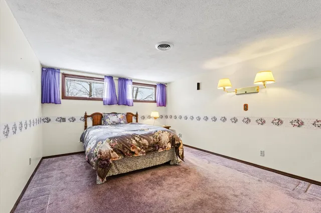 a view of a house with a snow in the yard