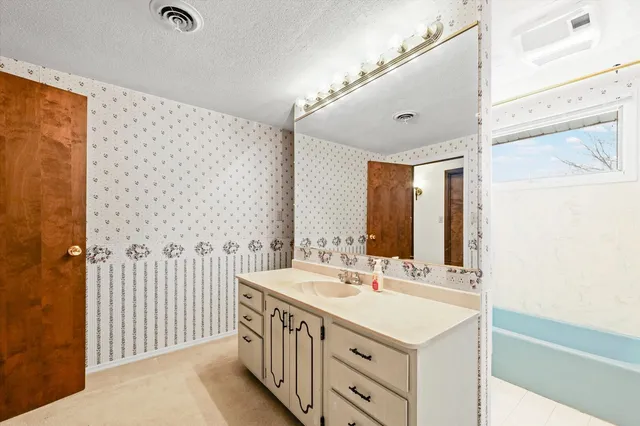 a front view of a house with outdoor seating