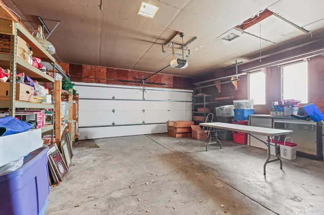 a view of a house with a backyard and a patio