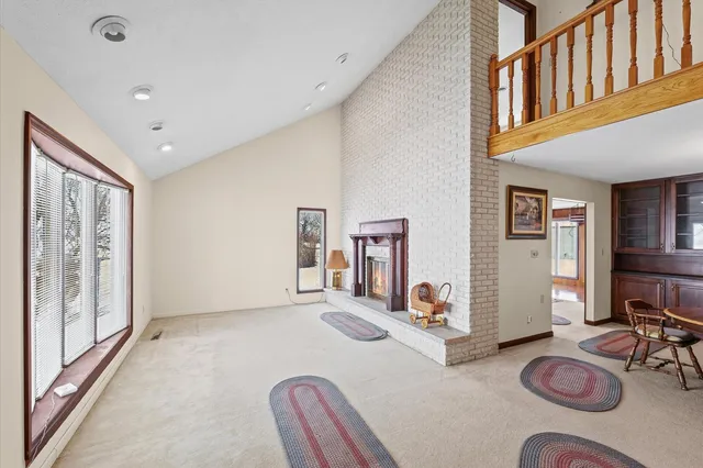 a dining room with furniture and wooden floor